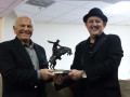 Amnon presenting Enzo with Frederick Remington's "The Broncho Buster"