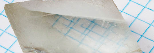 Birefringent crystal showing double refraction. Photo: APN MJM.