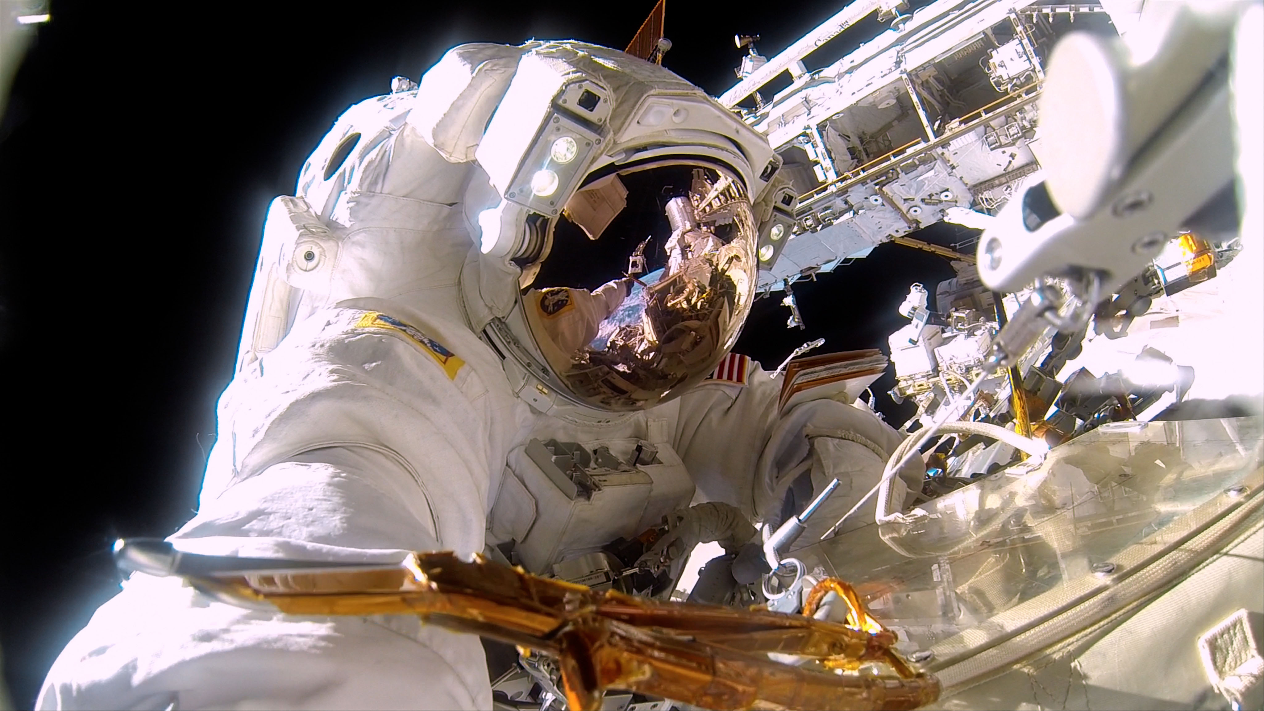 At left: NASA Commander Barry (Butch) Willmore on a spacewalk to repair the exterior of the International Space Station. It’s almost 300° on the sun side of the space station and -275° in the shade. Photo courtesy of NASA.
