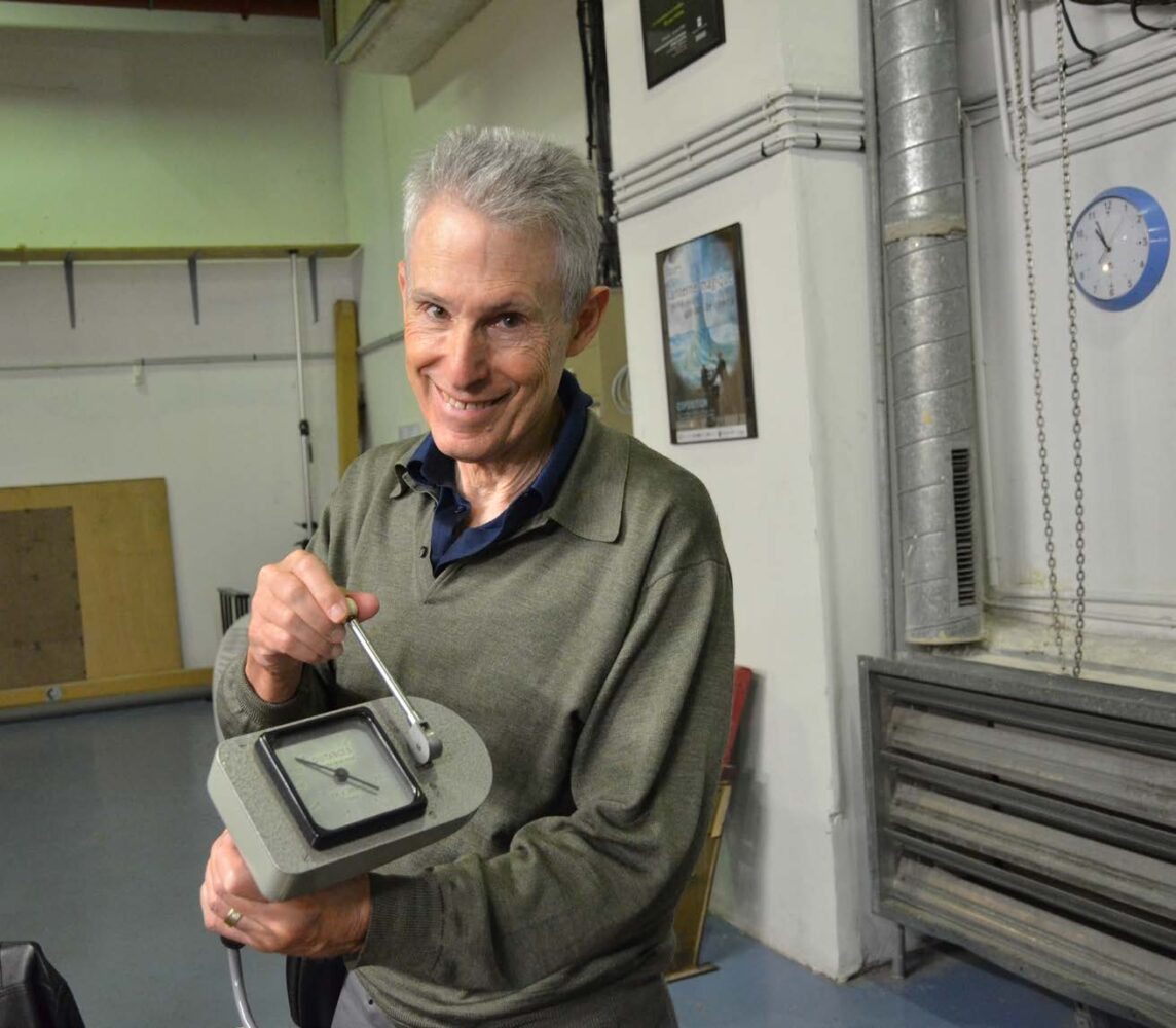 Howard Preston with a vintage Debrie mechanical remote follow focus hand unit in La Cinémathèque Française equipment collection.